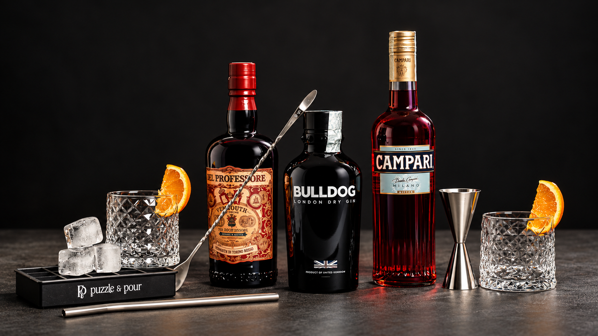 Box cocktail Negroni Puzzle & Pour con Bulldog Gin, Vermouth del Professore e Campari, completa di bicchieri e accessori per preparare a casa un Negroni perfetto. Un’idea regalo originale per amanti dei cocktail e della mixology.
